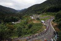 The pack rides during the sixth stage of the Tour de France cycling race over 160 kilometers (100 miles) with start in Mulhouse and finish in La Planche des Belles Filles, France, Thursday, July 11, 2019. (AP Photo/Christophe Ena)