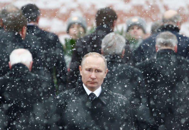 FILE PHOTO: Russian President Putin attends wreath laying ceremony to mark Defender of Fatherland Day at Tomb of Unknown Soldier by Kremlin wall in Moscow