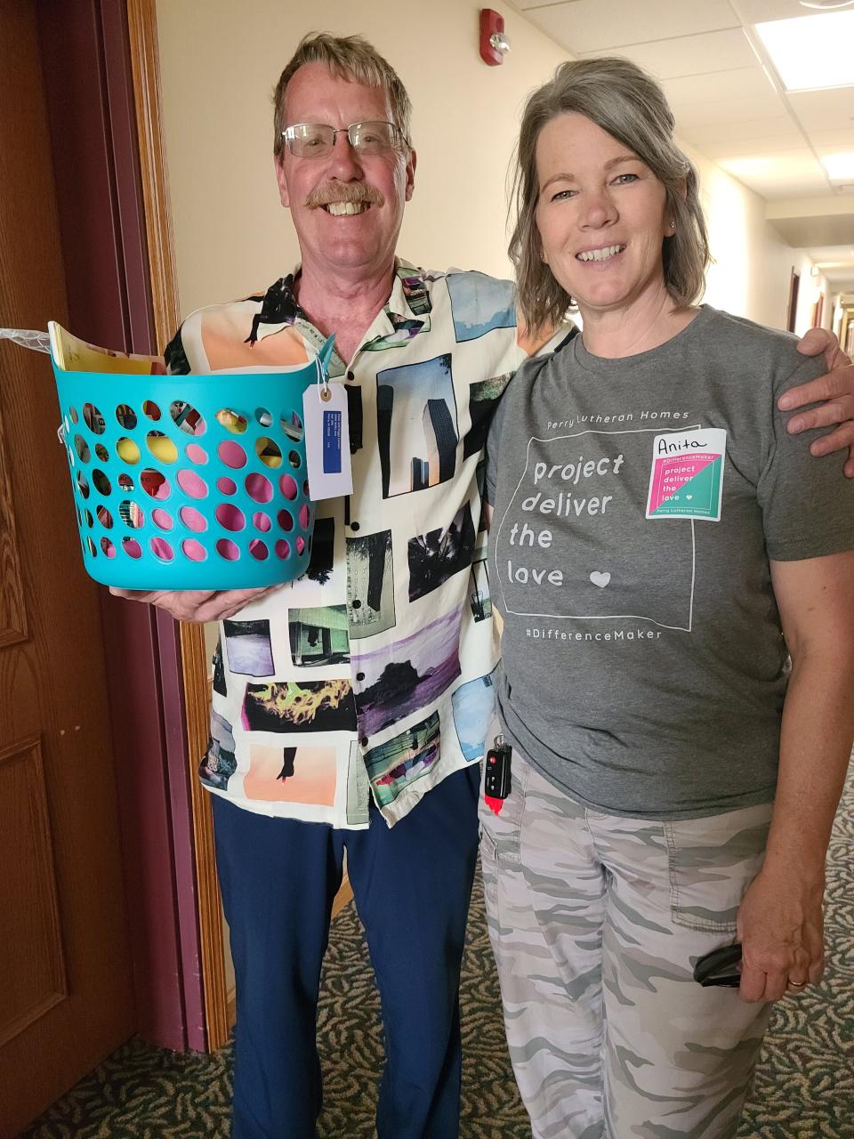 Dave Cannon poses for a photo after receiving a basket from Anita McVey, of Boone, through the Perry Lutheran Homes' Project Deliver the LOVE initiative on Thursday, May 11, 2023.