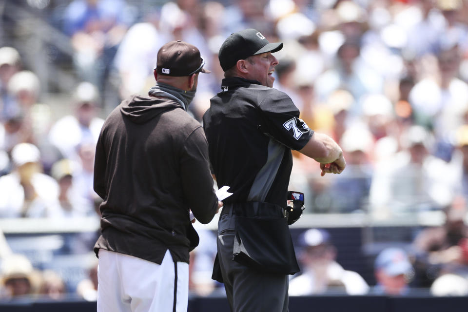 Home plate umpire Tripp Gibson, right, ejects San Diego Padres manager Jayce Tingler in the first inning of a baseball game against the New York Mets, Sunday, June 6, 2021, in San Diego. (AP Photo/Derrick Tuskan)