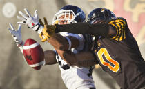 Hamilton Tiger-Cats Rico Murray (R) breaks up a pass to Toronto Argonauts Spencer Watt in the first half of their CFL football game in Guelph October 14, 2013. REUTERS/Fred Thornhill (CANADA - Tags: SPORT FOOTBALL TPX IMAGES OF THE DAY)