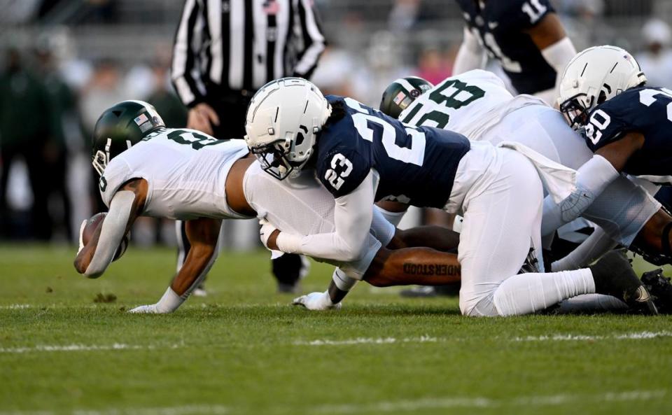 Penn State linebacker Curtis Jacobs tackles Michigan State’s Jalen Berger during the game on Saturday, Nov. 26, 2022.