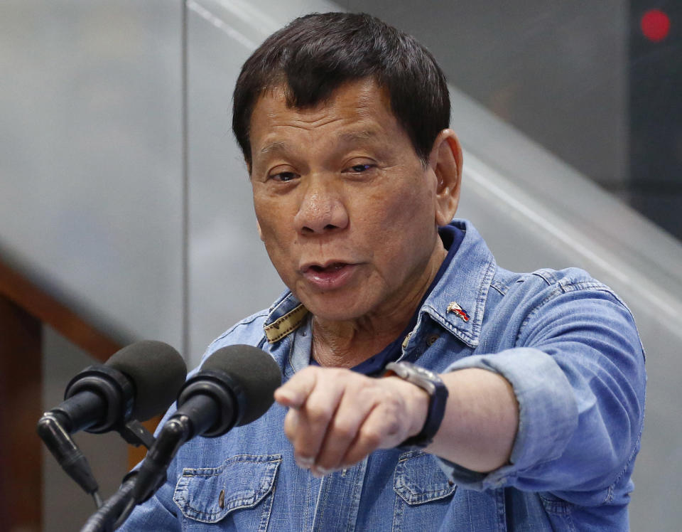 FILE - Philippine President Rodrigo Duterte addresses the Filipino Overseas Workers, Feb. 13, 2018, at the Ninoy Aquino International Airport in suburban Pasay city, southeast of Manila, Philippines. His daughter, Sara Duterte, said Tuesday, June 25, 2024, that the former president and her two brothers plan to run for the Senate in mid-term elections next year. (AP Photo/Bullit Marquez, File)