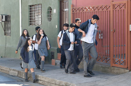 Students return home after classes have been suspended after a magnitude 5.7 earthquake hit off the coast in Vina del Mar, Chile April 28, 2017. REUTERS/Rodrigo Garrido