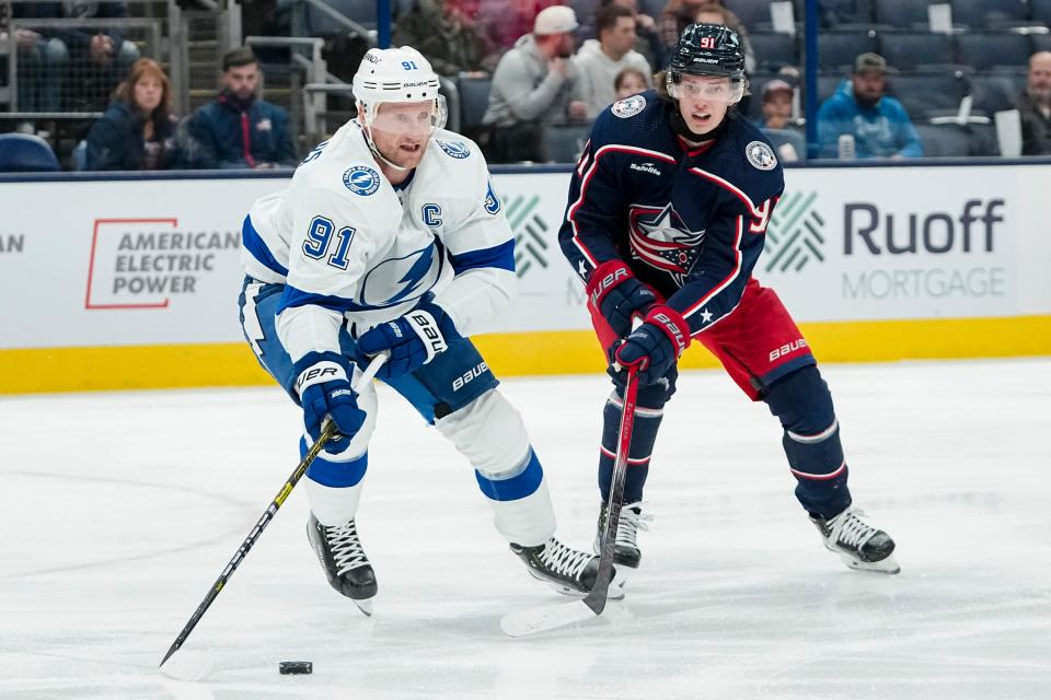 Nov 1, 2023; Columbus, Ohio, USA; Tampa Bay Lightning center Steven Stamkos (91) skates around Columbus Blue Jackets center Kent Johnson (91) during the first period of the NHL hockey game at Nationwide Arena.