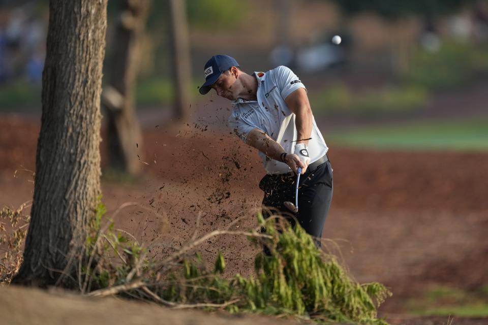 Viktor Hovland of Norway plays his second shot on the 18th hole during the round three of the DP World Tour Championship golf tournament, in Dubai, United Arab Emirates, Saturday, Nov. 18, 2023. (AP Photo/Kamran Jebreili)