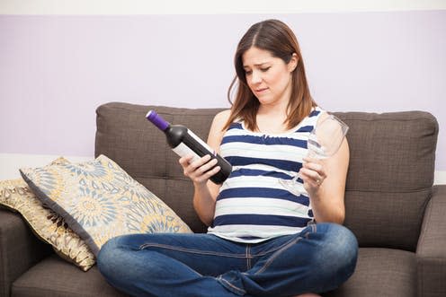 <span class="caption">To drink or not?</span> <span class="attribution"><a class="link " href="https://www.shutterstock.com/image-photo/pretty-young-pregnant-woman-holding-bottle-488111002?src=FnQoIWNTmpebG49fcuAnHQ-1-8" rel="nofollow noopener" target="_blank" data-ylk="slk:antoniodiaz/Shutterstock;elm:context_link;itc:0;sec:content-canvas">antoniodiaz/Shutterstock</a></span>