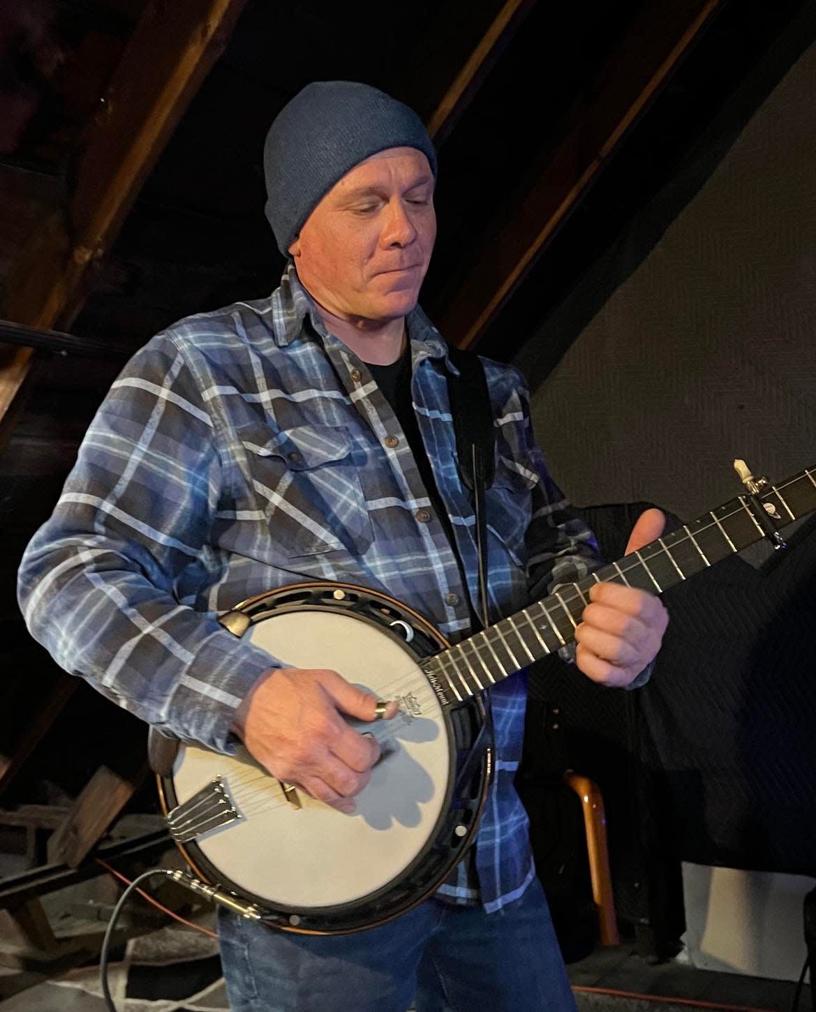 Ken Short of Paris Township rehearses with the Aaron Hymes Band.