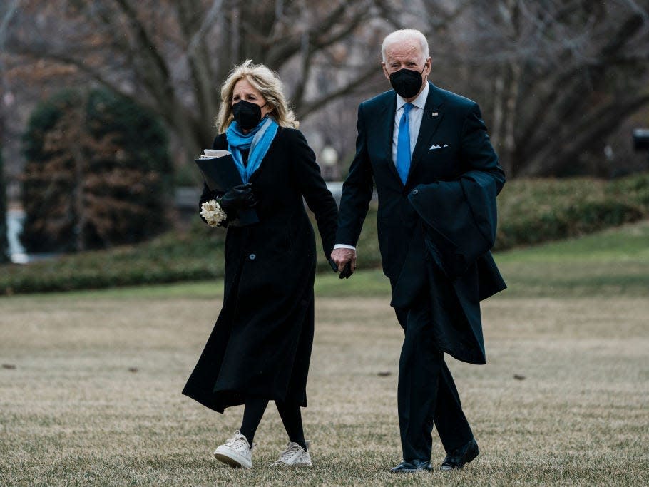 Joe Biden and Jill Biden wear matching blue accessories.