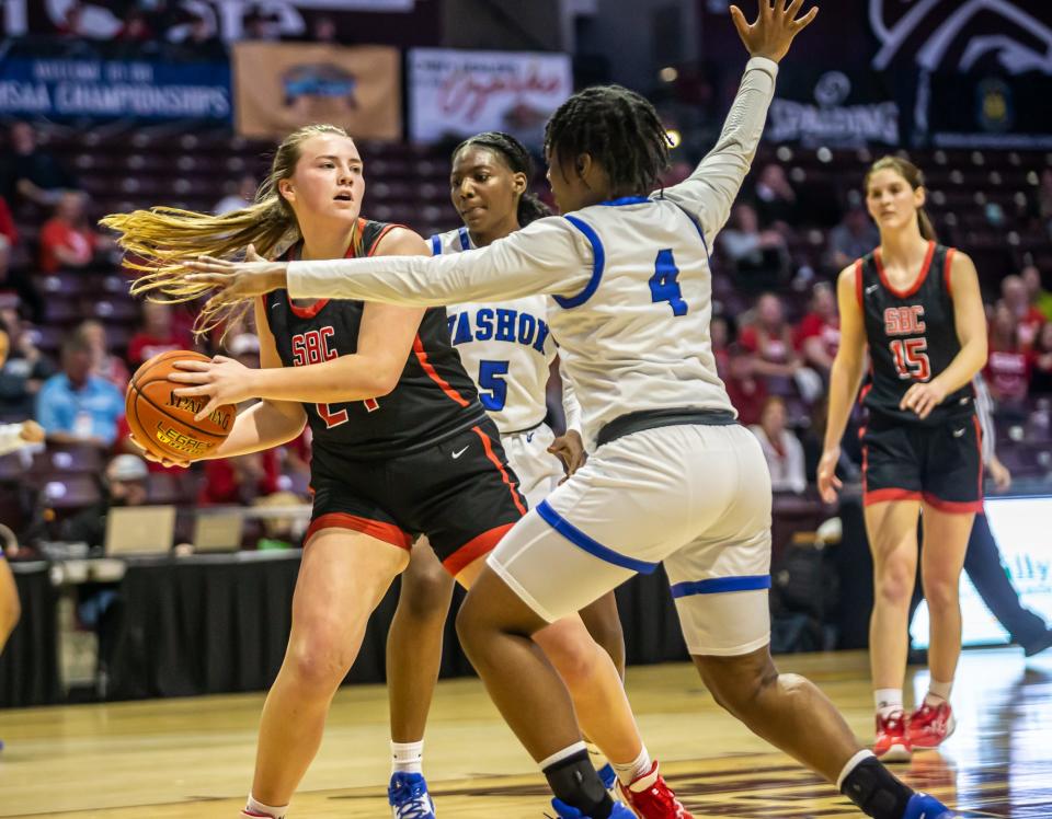 Southern Boone's Emilee DeHaas looks to pass while being pressured by Vashon's Rayvin Jones during a Class 4 girls semifinal basketball game on Thursday, March 16, 2023, at Missouri State University in Springfield, Mo.