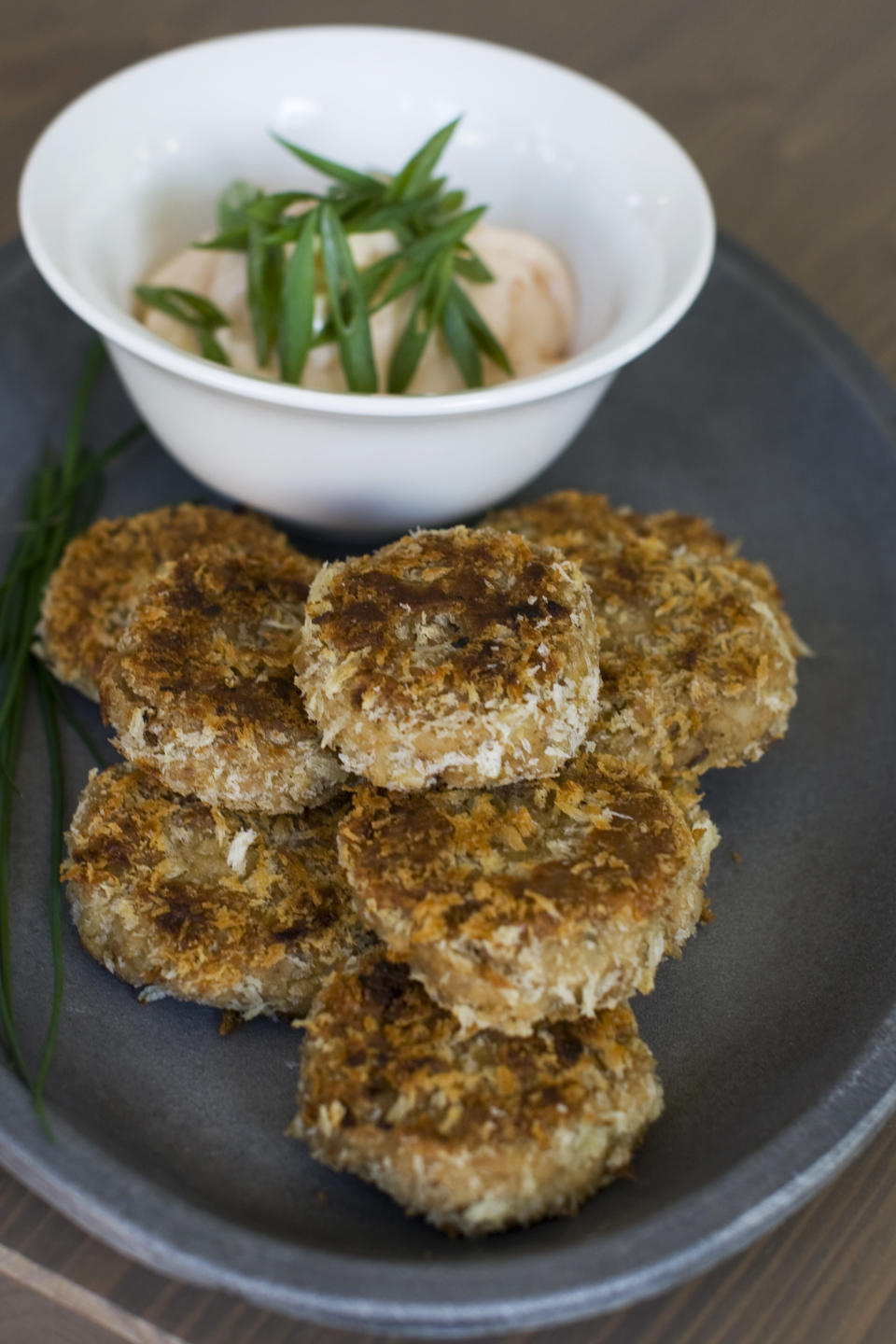 In this image taken on Nov. 26, 2012, black eyed pea falafel with spicy aioli sauce is shown on a serving tray in Concord, N.H. (AP Photo/Matthew Mead)