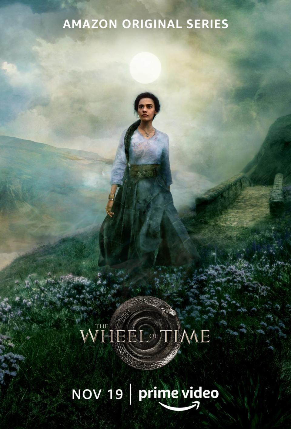 A Wheel of Time poster showing Egwene on a hillside