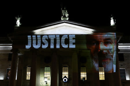 Projections showing victims of clerical abused are seen on the General Post Office (GPO) as part of a protest, ahead of a visit by Pope Francis, in Dublin, Ireland August 24, 2018. REUTERS/Hannah McKay