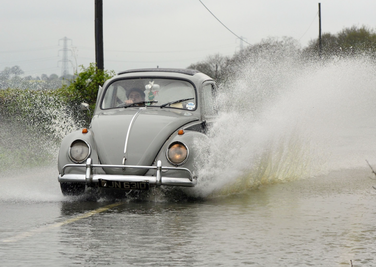 Splashing pedestrians while driving through puddles is illegal (Rex/stock photo)