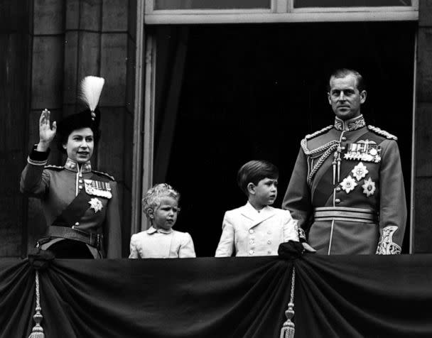 PHOTO: Queen Elizabeth II in uniform as Colonel Chief of the Grenadier Guards, with Prince Charles, Princess Anne and The Prince Philip, Duke of Edinburgh, waving from the balcony of Buckingham Palace, in London, June, 1953. (Fox Photos/Getty Images, FILE)
