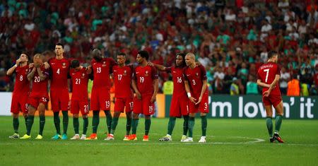 Football Soccer - Poland v Portugal - EURO 2016 - Quarter Final - Stade Velodrome, Marseille, France - 30/6/16 Portugal's Cristiano Ronaldo (R) watches with team mates during the penalty shootout REUTERS/Kai Pfaffenbach Livepic