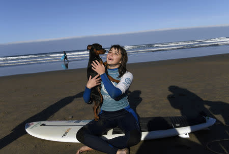 Carmen Lopez Garcia, Spain's first blind female surfer who is to participate in the ISA World Adaptive Surfing Championship, takes a break from training at Salinas beach, Spain, December 6, 2018. REUTERS/Eloy Alonso