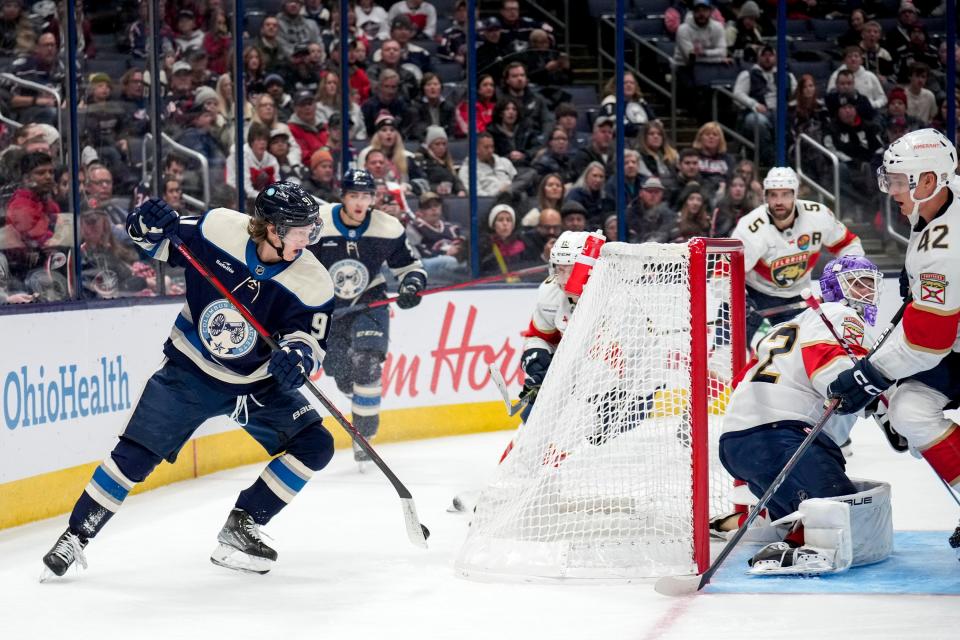 Blue Jackets forward Kent Johnson attempts to score a goal against Panthers goaltender Sergei Bobrovsky during the third period of Columbus' 5-3 win Sunday.