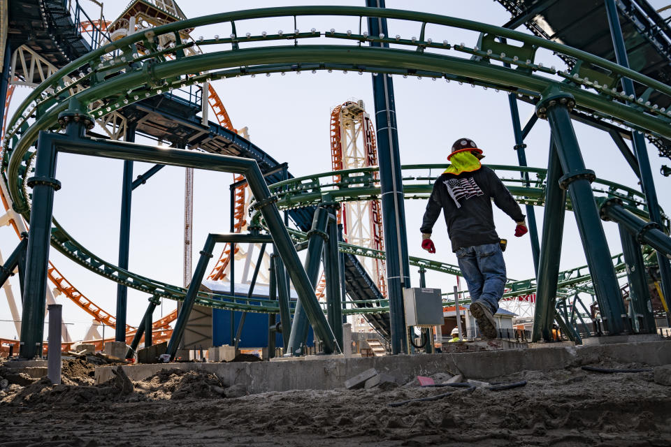 Construction is underway in the amusement park district of Coney Island, Friday, June 17, 2022, in the Brooklyn borough of New York. Luna Park in Coney Island will open three new major attractions this season alongside new recreational areas and pedestrian plazas. (AP Photo/John Minchillo)