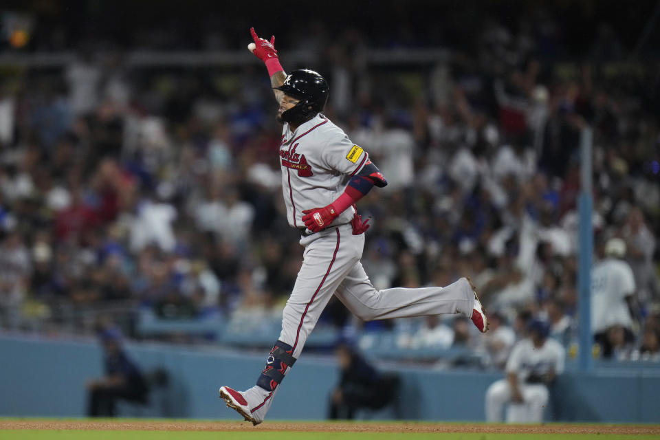 Atlanta Braves' Orlando Arcia runs the bases after hitting a three-run home run against the Los Angeles Dodgers during the 10th inning of a baseball game Saturday, Sept. 2, 2023, in Los Angeles. (AP Photo/Jae C. Hong)