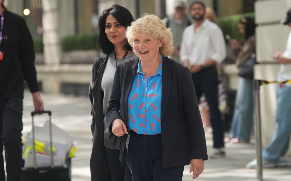 Jo Hamilton wears a colourful shirt and smiles broadly