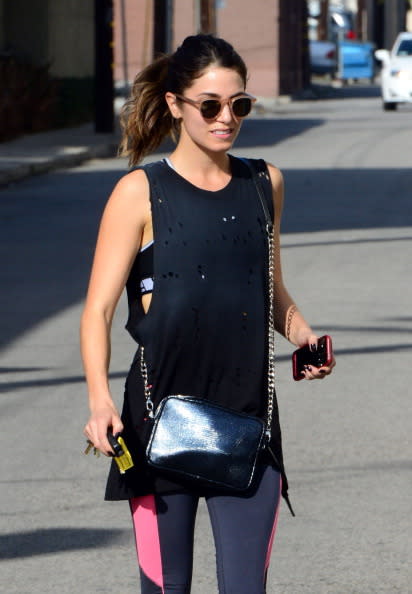 <p>A distressed vest and glimpse of sports bra is definitely a style statement but we love it! Nikki Reed is workout style goals. (Photo by Bauer-Griffin/GC Images/ Getty Images)</p>