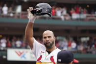 St. Louis Cardinals' Albert Pujols tips his cap after hitting a two-run home run during the eighth inning of a baseball game against the Chicago Cubs Sunday, Sept. 4, 2022, in St. Louis. (AP Photo/Jeff Roberson)