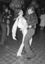 <p>Russian ballet dancer Mikhail Baryshnikov trades in his tights for bell-bottoms as he hits the dance floor with Liza Minnelli. </p>