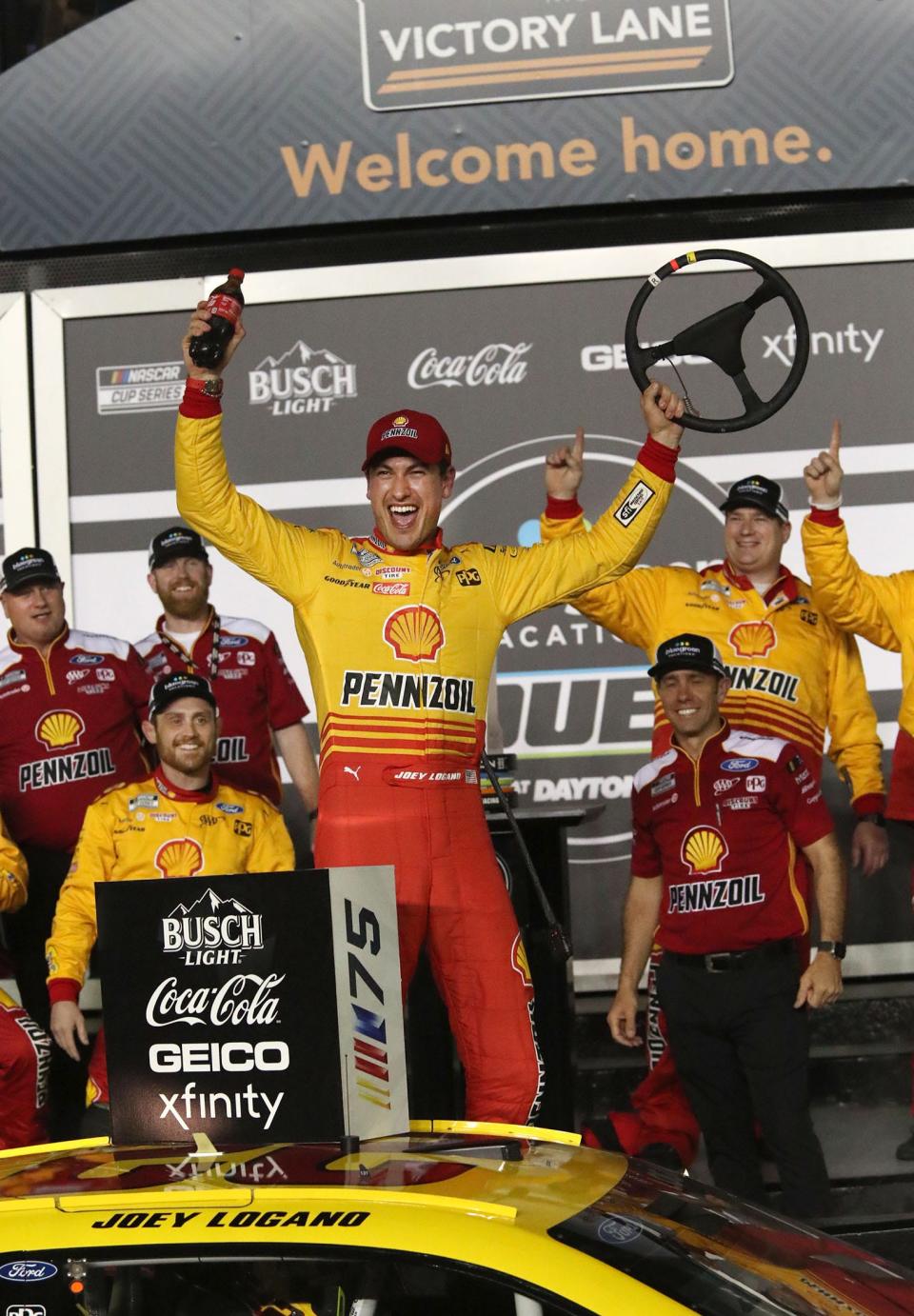 Joey Logano celebrates in Victory Lane after winning the first Bluegreen Vacations Duel race on Thursday at Daytona International Speedway.