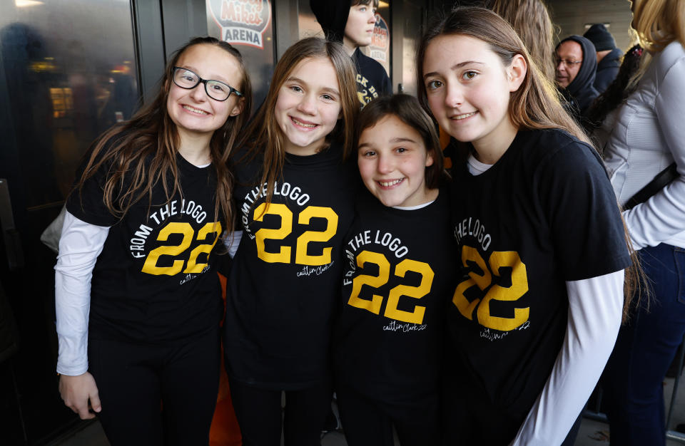 FILE - Caitlin Clark fans, from left, Layla Lehansky, Leah Railski, Emma Lawrence and Alexa Lehansky, of West Milford, N.J., pose for photos while waiting in line to enter the arena for an NCAA college basketball game between Iowa and Rutgers Friday, Jan. 5, 2024, in Piscataway, N.J. While teams like Tennessee and UConn would draw huge crowds on the road in the past and South Carolina has had a strong fan base the last few years, there's never been anything like it in women's basketball when an individual player has drawn so much interest from fans wanting to see her play. (AP Photo/Noah K. Murray, File)