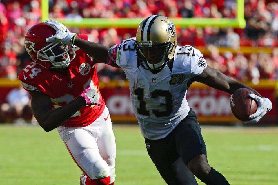 Oct 23, 2016; Kansas City, MO, USA; New Orleans Saints wide receiver Michael Thomas (13) stiff arms Kansas City Chiefs cornerback D.J. White (24) during the second half at Arrowhead Stadium. The Chiefs won 27-21. Mandatory Credit: Jeff Curry-USA TODAY Sports