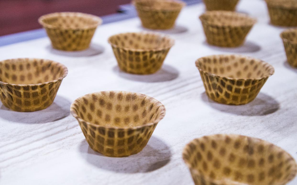 Waffle cups move down the conveyor belt at the Joy Cone Company plant in Flagstaff, Wednesday, November 29, 2018.