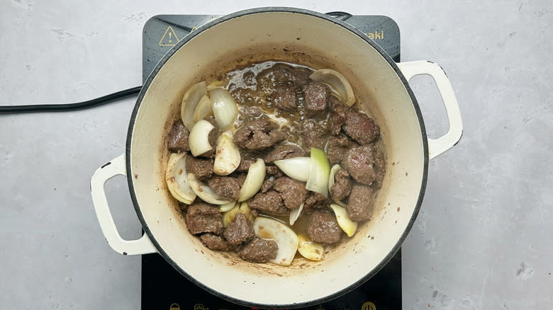 beef and onions in pot
