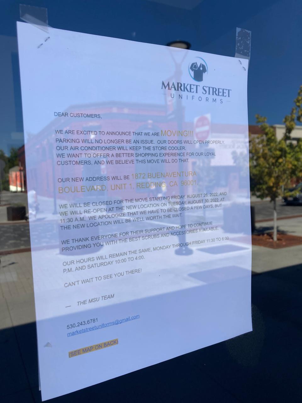 A sign was posted on the front of Market Street Uniforms announcing the move to Buenaventura Boulevard.