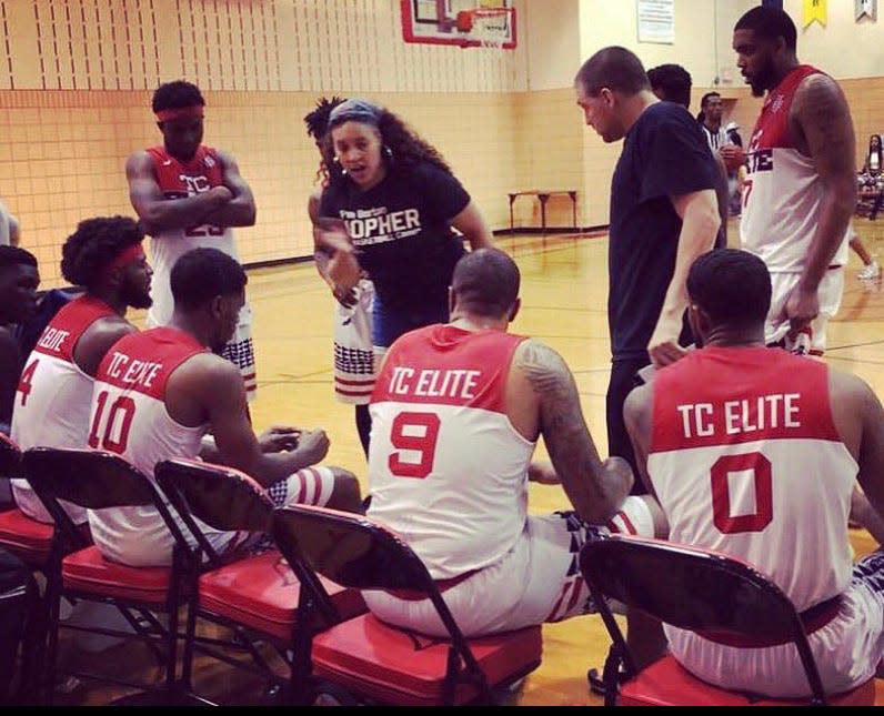 Tamara Moore, a college basketball standout who played five years in the WNBA, is shown here coaching one of the men's semi-pro teams in the league she founded, the Official Basketball Association. This year, Moore became the first Black woman to be named a coach of a men's collegiate basketball program.