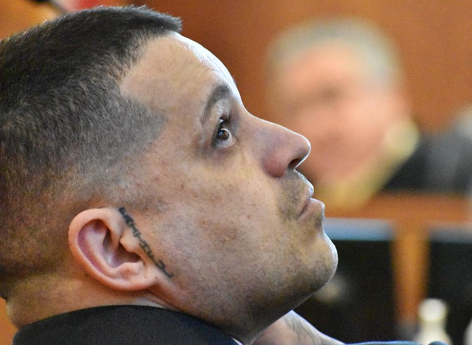 Defendant Nelson Coelho listens in court in Fall River on Wednesday, May 1, 2024. Coelho is accused of gunning down Lal Kishor Mahaseth during an attempted robbery in 2021.