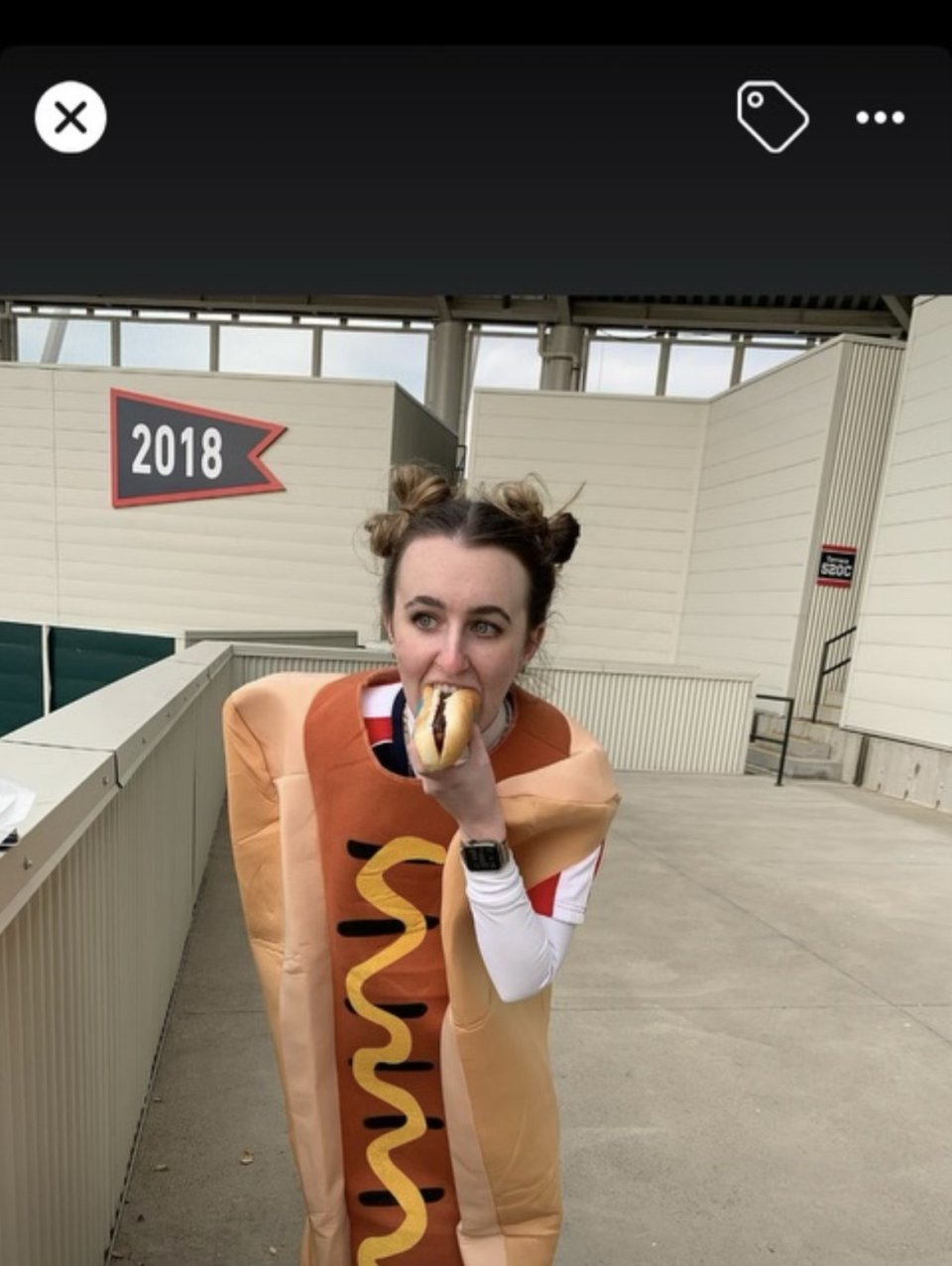 Megan Keleman's dad took her out of school once a year so they could go to the Cleveland Guardians' home opener. They both cheered during the hot dog races on the field — him for Mustard, her for Onion. Megan eventually bought her own hot dog costume, which she's wearing here. She sometimes wore it to games, but she kept it in the trunk of her car to bring unexpected smiles and silliness to others.