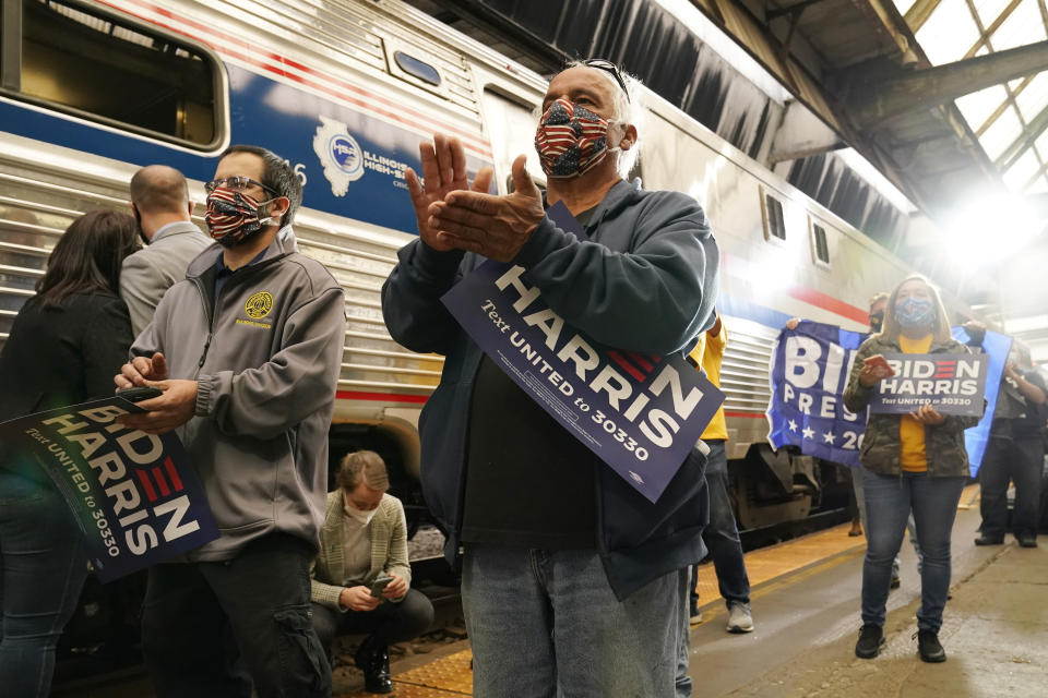 Supporters applaud as Democratic presidential candidate former Vice President Joe Biden speaks at Amtrak's Pittsburgh Train Station, Wednesday, Sept. 30, 2020, in Pittsburgh. Biden is on a train tour through Ohio and Pennsylvania today. (AP Photo/Andrew Harnik)