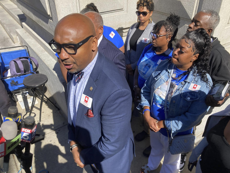 Mawuli Davis, a lawyer for relatives of Johnny Hollman Sr., speaks to reporters, Monday, Oct. 9, 2023, outside the Fulton County courthouse in Atlanta. Davis says an Atlanta police video showing events leading to Hollman's Aug. 10, death during a traffic stop is likely to be released in coming days. (AP Photo/Jeff Amy)