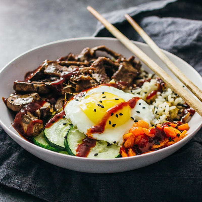 <p>Bibimbap is a Korean beef bowl with rice, marinated beef, an assortment of vegetables like mushrooms and zucchini, and sunny side up eggs. Everything’s tossed in a deliciously spicy-sweet bibimbap sauce.</p><p><strong>Get the recipe: <a href="https://www.savorytooth.com/bibimbap/" rel="nofollow noopener" target="_blank" data-ylk="slk:Bibimbap;elm:context_link;itc:0;sec:content-canvas" class="link ">Bibimbap</a></strong></p>