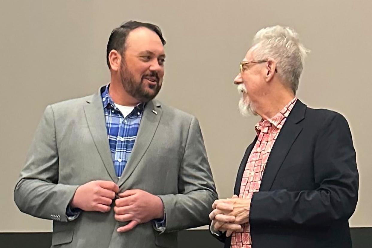 <span>Judd Blevins, left, a city councilor in Enid, Oklahomas, speaks with an Enid resident on 26 March 2024.</span><span>Photograph: Sean Murphy/AP</span>