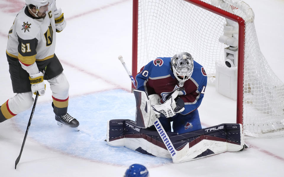 Colorado Avalanche goaltender Alexandar Georgiev, right, stops a shot by Vegas Golden Knights right wing Mark Stone during the third period of an NHL hockey game Wednesday, Jan. 10, 2024, in Denver. (AP Photo/David Zalubowski)