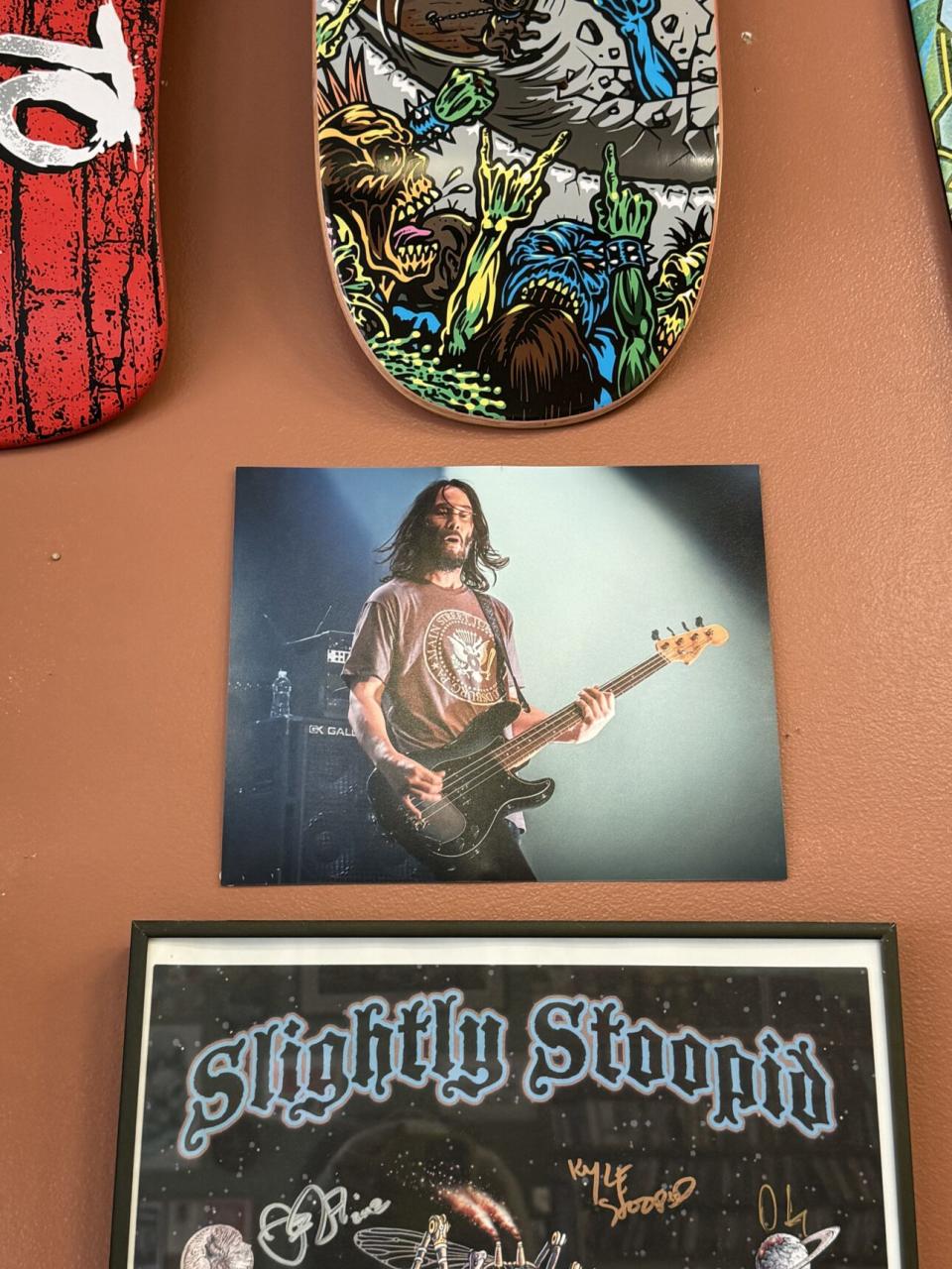 A photo of Keanu Reeves wearing a Main Street Juke Box T-shirt hangs on the store’s wall.