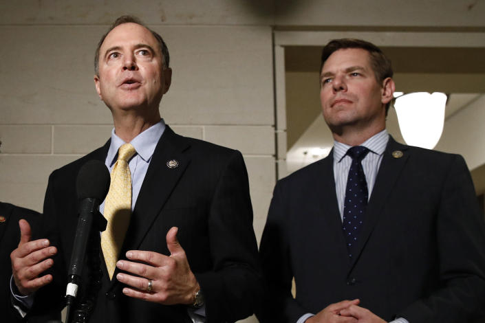 FILE - In this May 28, 2019 file photo, Rep. Adam Schiff, D-Calif., left, and Rep. Eric Swalwell, D-Calif., speak with members of the media on Capitol Hill in Washington. The Justice Department under former President Donald Trump secretly seized data from the accounts of at least two Democratic lawmakers in 2018 as part of an aggressive crackdown on leaks related to the Russia investigation and other national security matters, according to three people familiar with the seizures. (AP Photo/Patrick Semansky)