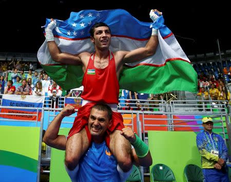 2016 Rio Olympics - Boxing - Final - Men's Fly (52kg) Final Bout 271 - Riocentro - Pavilion 6 - Rio de Janeiro, Brazil - 21/08/2016. Shakhobidin Zoirov (UZB) of Uzbekistan celebrates after winning his bout. REUTERS/Peter Cziborra