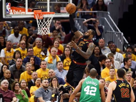 May 19, 2018; Cleveland, OH, USA; Cleveland Cavaliers forward LeBron James (23) attempts a layup in front of forward Larry Nance Jr. (22) and Boston Celtics forward Al Horford (42) during the first half of game three of the Eastern conference finals in the 2018 NBA Playoffs at Quicken Loans Arena. Mandatory Credit: Aaron Doster-USA TODAY Sports