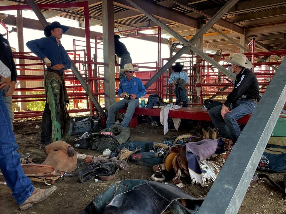 Saddle Bronc riders get ready for their turns at the Ponoka Stampede, June 28.