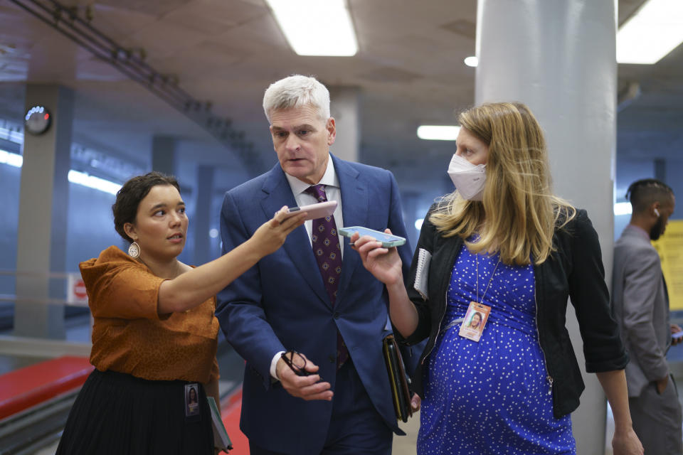 Sen. Bill Cassidy, R-La., is accompanied by reporters as intense negotiations continue to salvage a bipartisan infrastructure deal, at the Capitol in Washington, Tuesday, July 27, 2021. (AP Photo/J. Scott Applewhite)