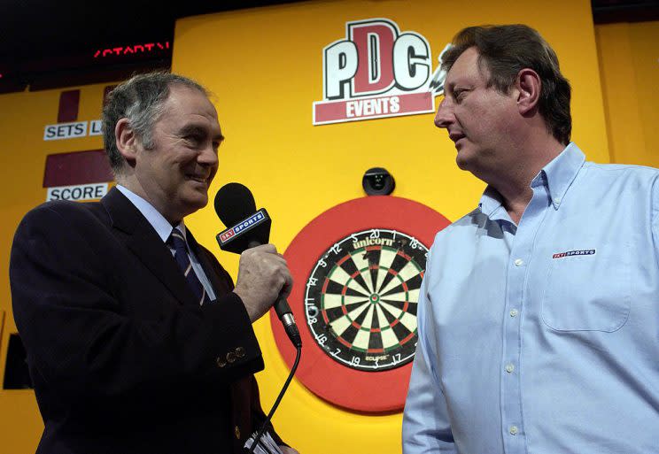 2 Jan 2002: Sid Waddell, the legendary darts commentator interviews Eric Bristow prior to the second round matches in the PDC Skol World Darts Championships at The Circus Tavern, Purfleet, Essex. DIGITAL IMAGE Mandatory Credit: John Gichigi/Getty Images