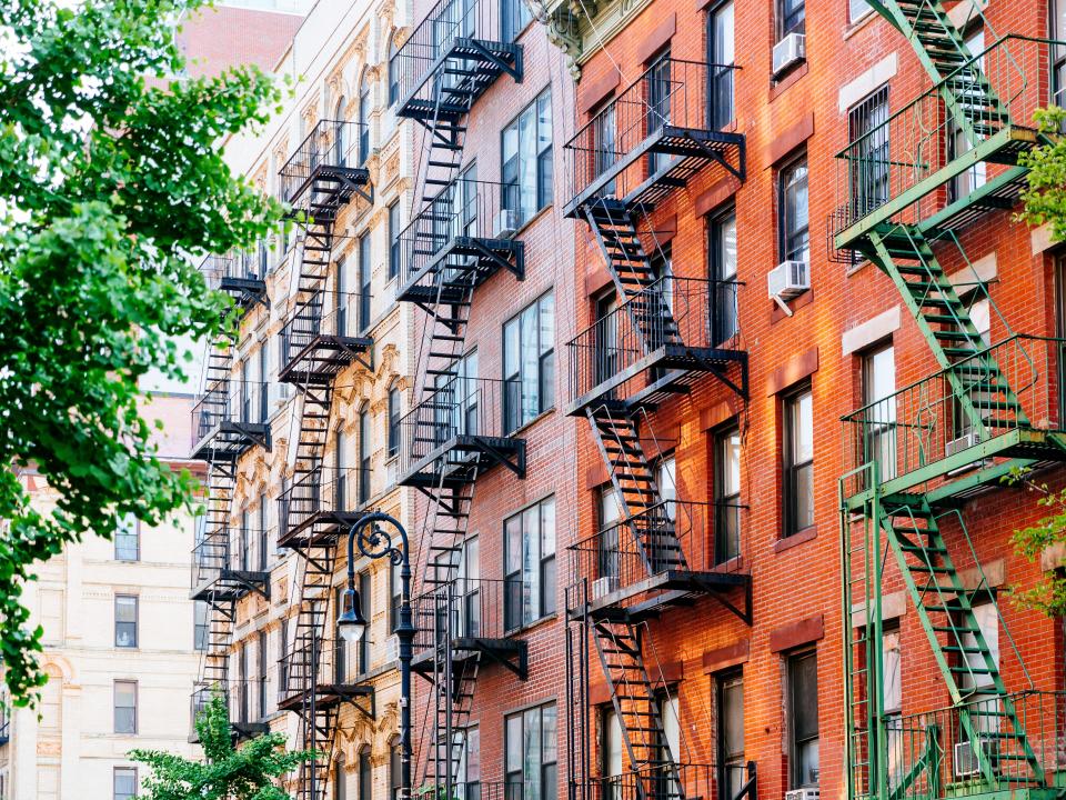 house facade with fire escape stairs in East Village, Manhattan, New York